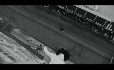 a black and white photo of a person on a skateboard