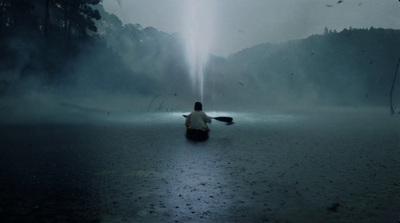 a person sitting on a boat in the water