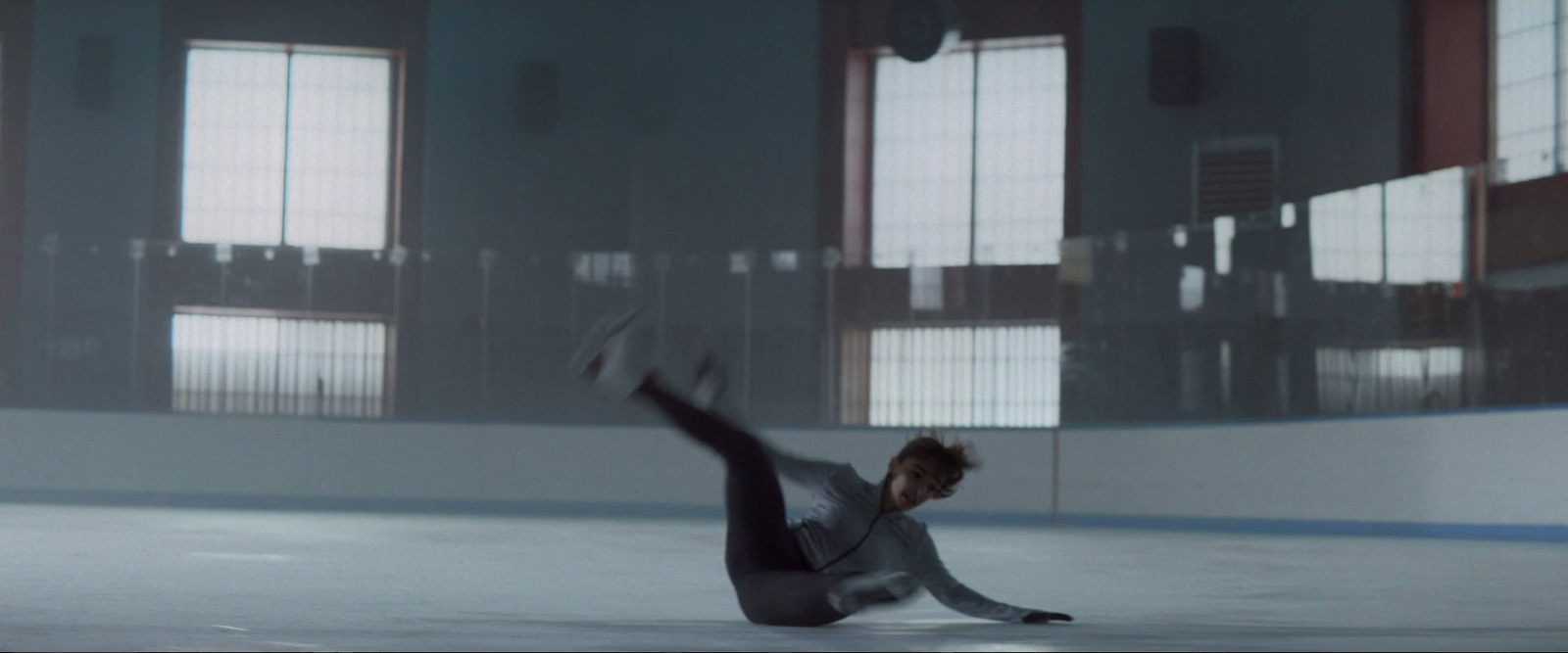 a man is doing a trick on the ice