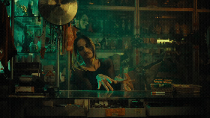 a woman sitting at a counter in a store