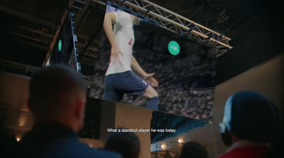 a man standing on a stage in front of a crowd