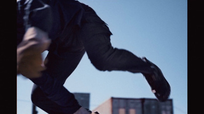 a man riding a skateboard up the side of a ramp