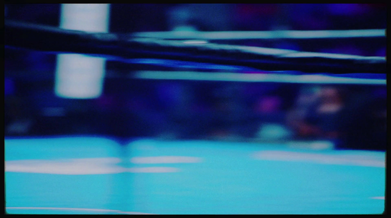 a blurry photo of a boxing ring