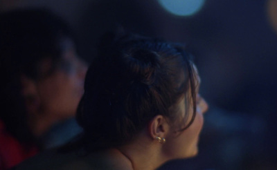 a close up of a woman's face in the dark