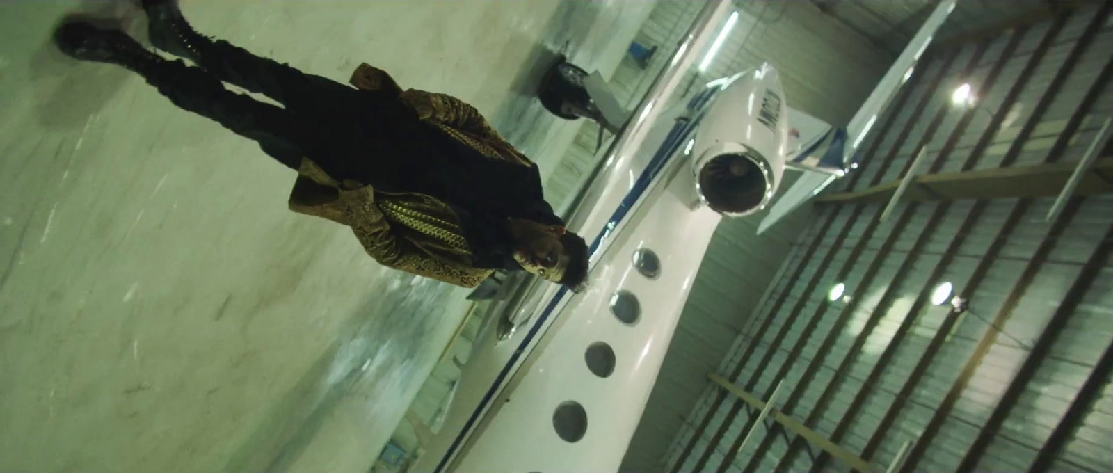 a man standing in front of a space shuttle