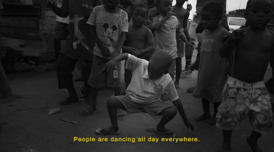 a black and white photo of a group of children dancing