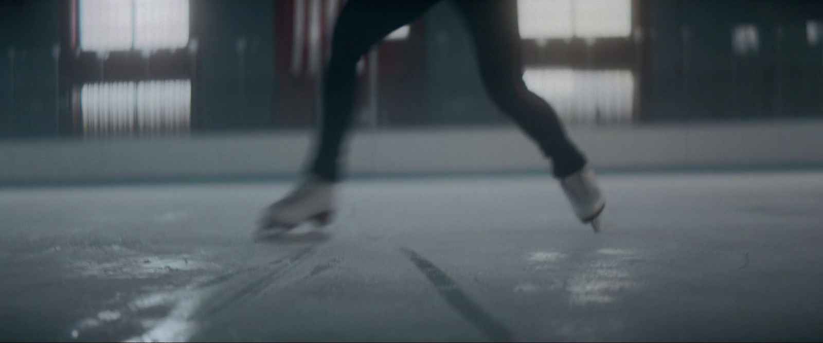 a blurry photo of a person skating on a rink