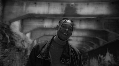 a man standing in a tunnel with his eyes closed