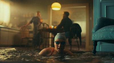 a woman swimming in a pool of water