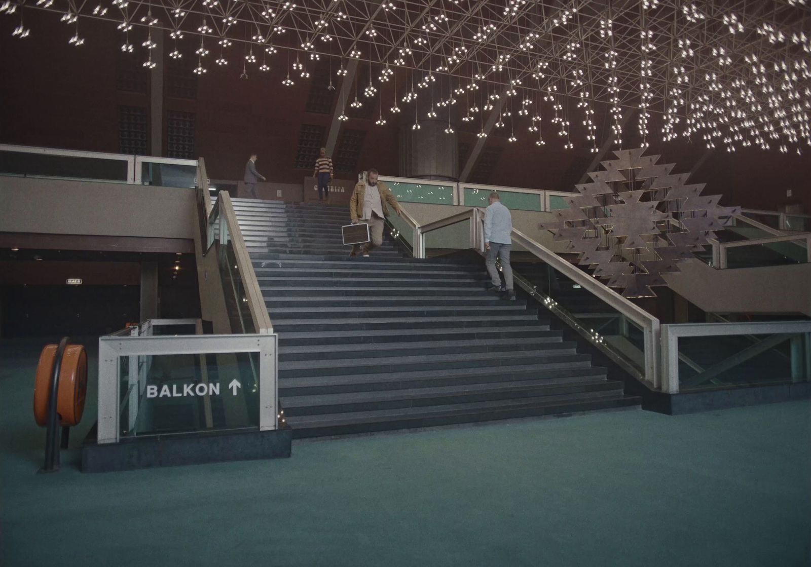 a couple of people that are walking down some stairs