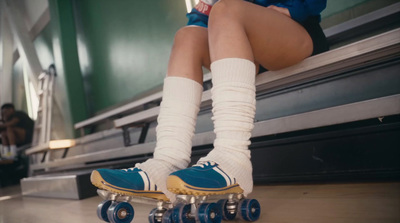 a person riding a skateboard down a hallway