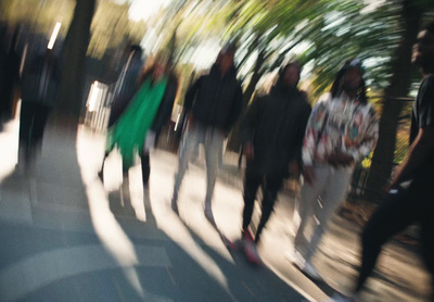 a group of people walking down a street