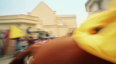 a blurry photo of people walking down a street