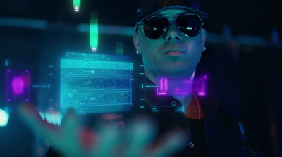 a man in sunglasses holding a tablet in a dark room