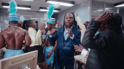 a man in a blue suit and a group of people