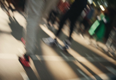 a blurry photo of a person riding a skateboard