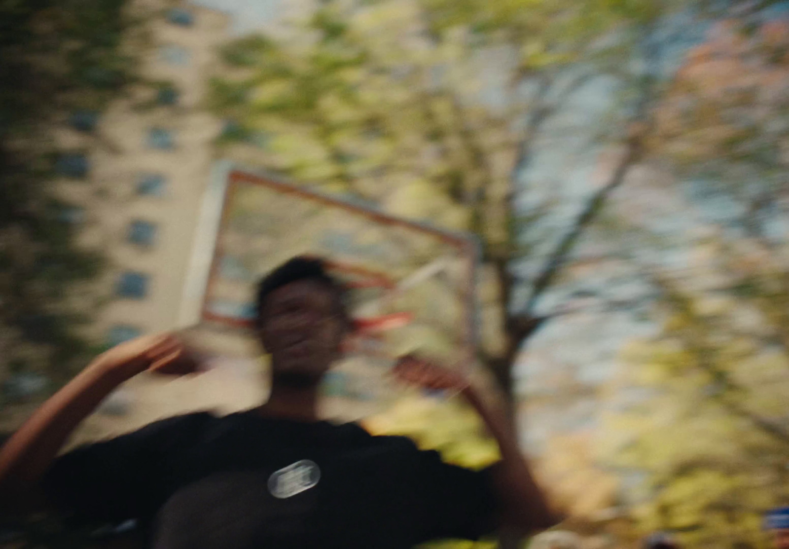 a man is throwing a frisbee in a park