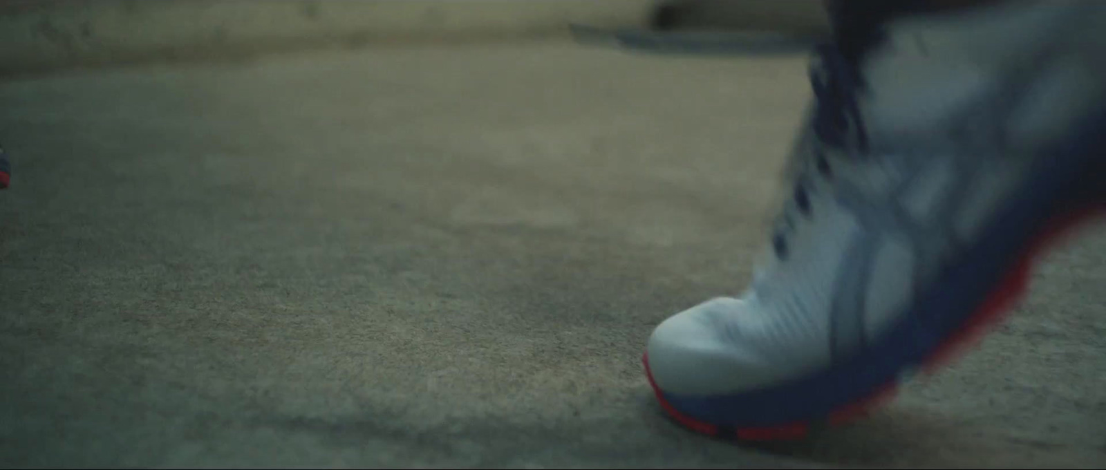 a close up of a person's shoes on the ground