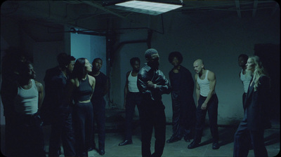 a group of people standing in a dark room