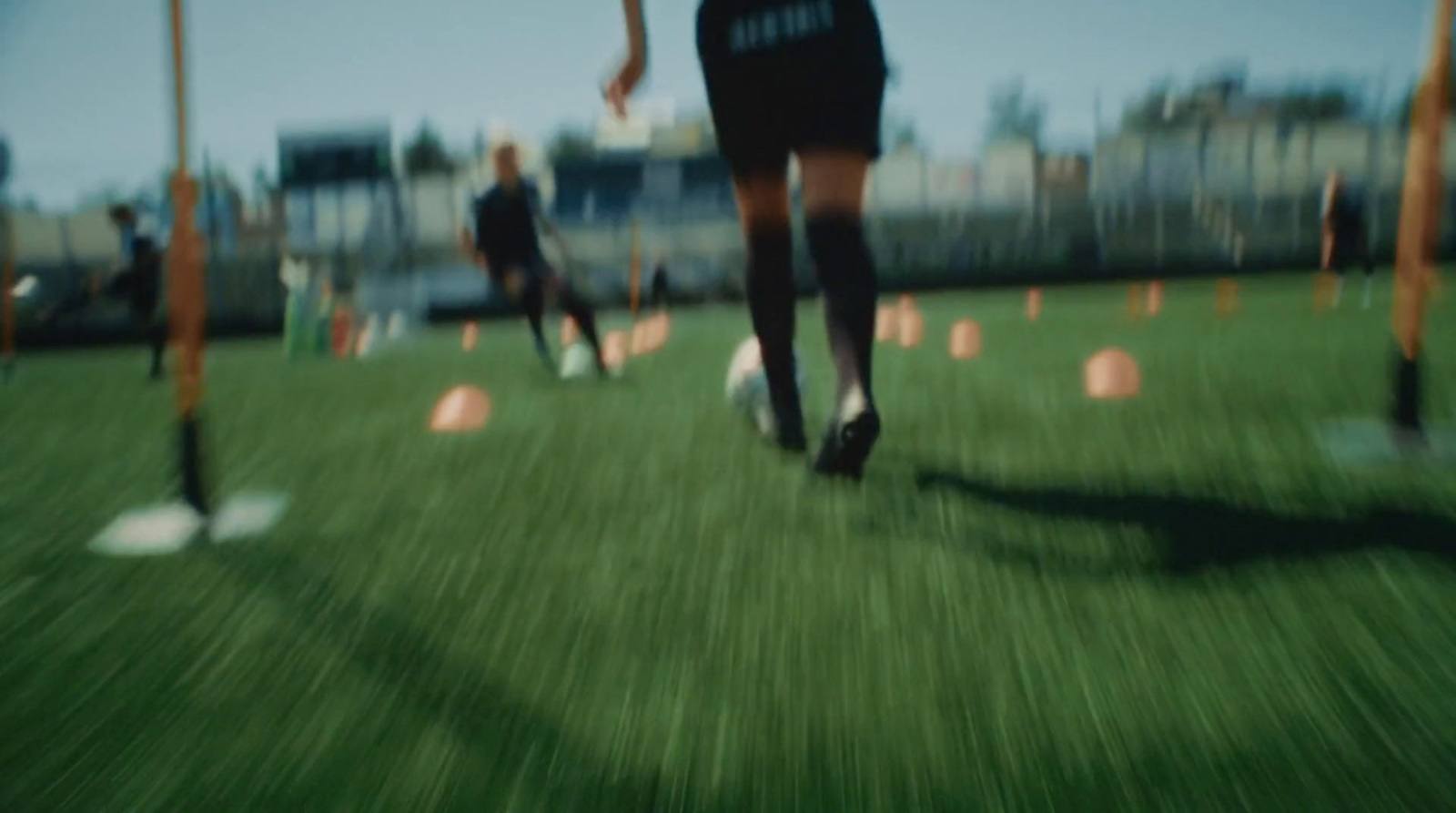 a blurry photo of a person walking on a field