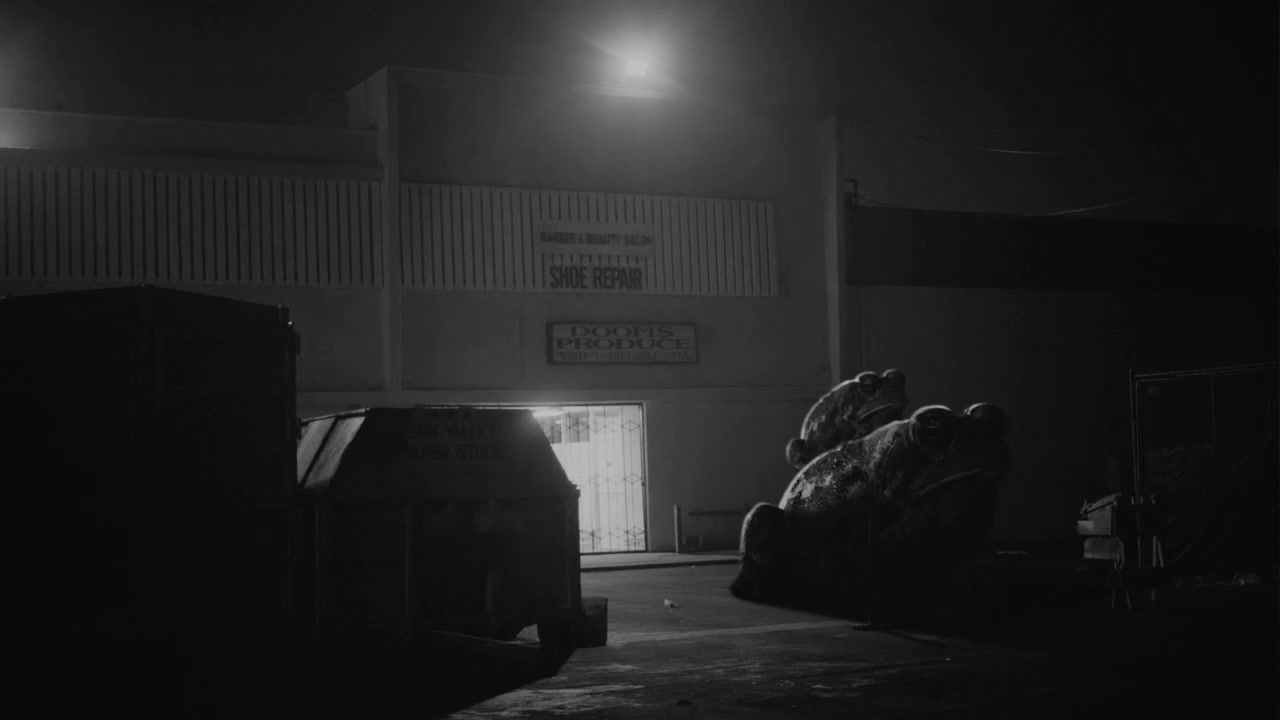 a black and white photo of a building at night