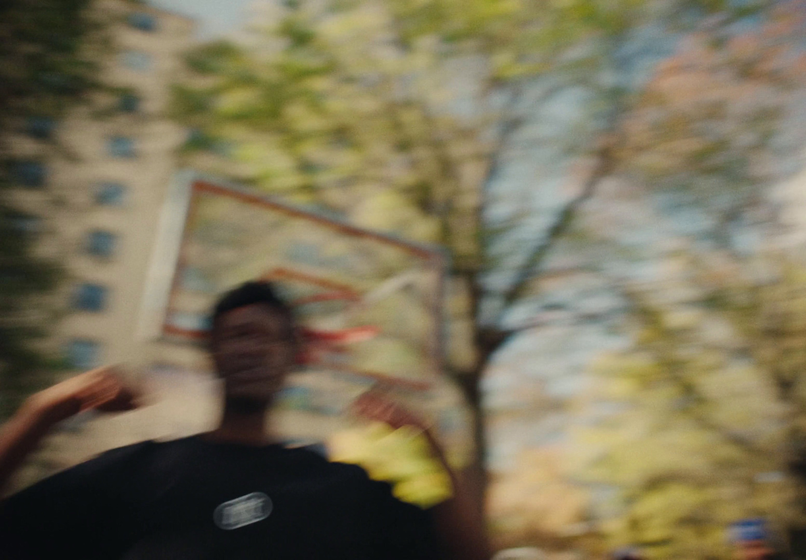 a blurry photo of a man throwing a frisbee