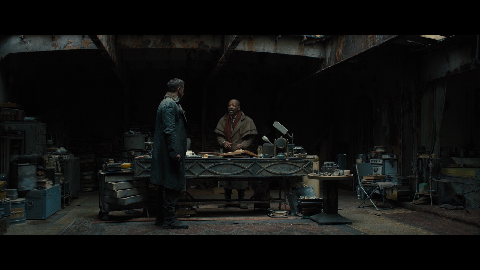 two men in a factory working on a piece of equipment