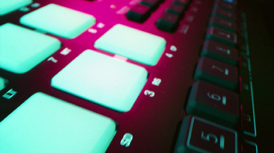 a close up of a keyboard with a red background