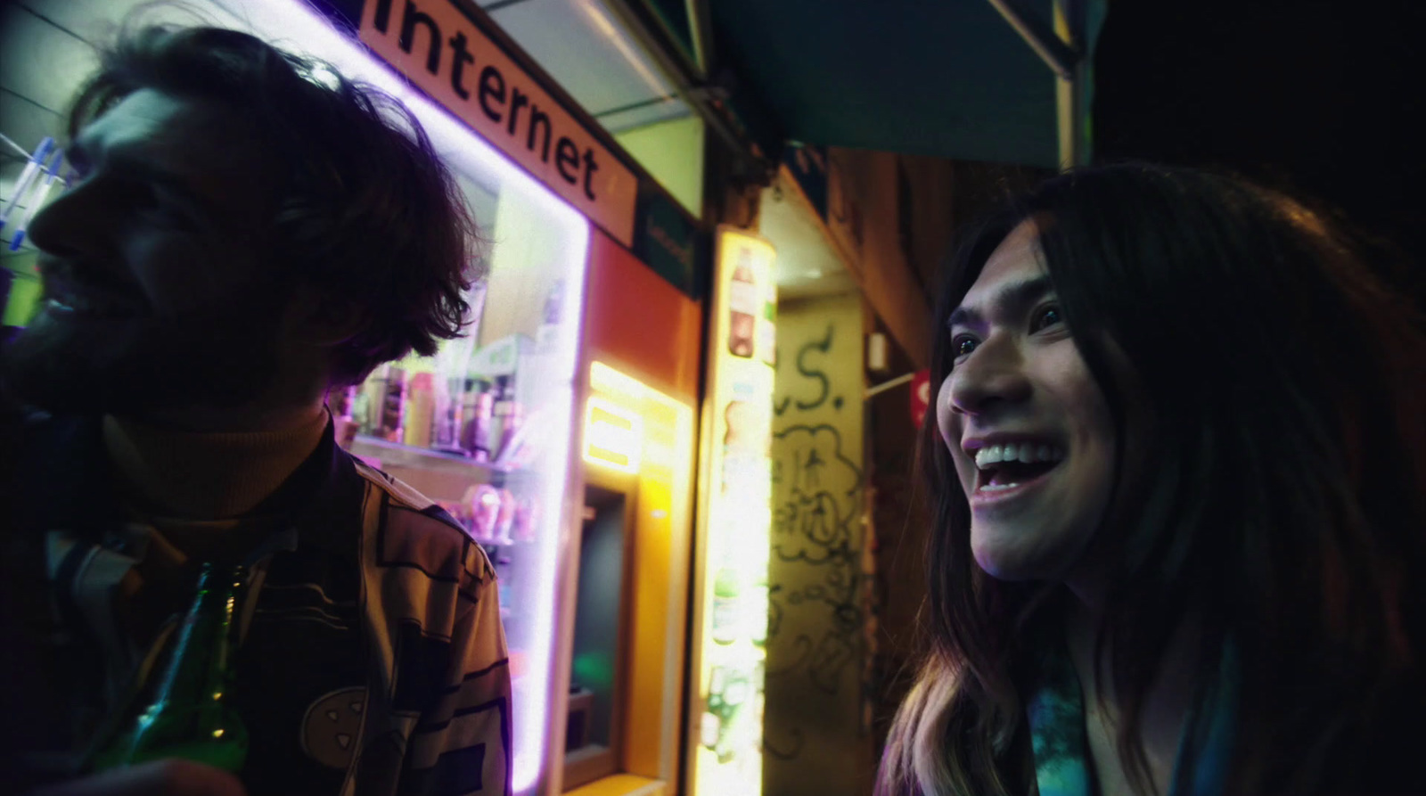 a man and a woman standing in front of a store