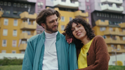 a man and a woman standing next to each other