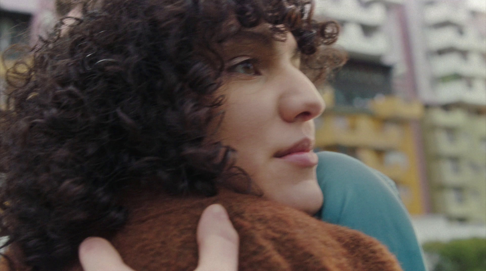 a close up of a person holding a teddy bear