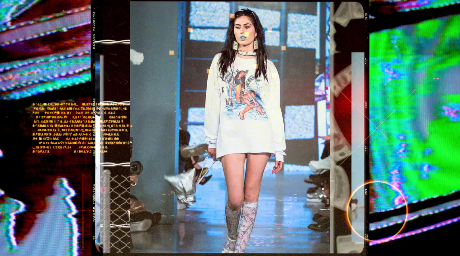 a woman walking down a runway in a white dress