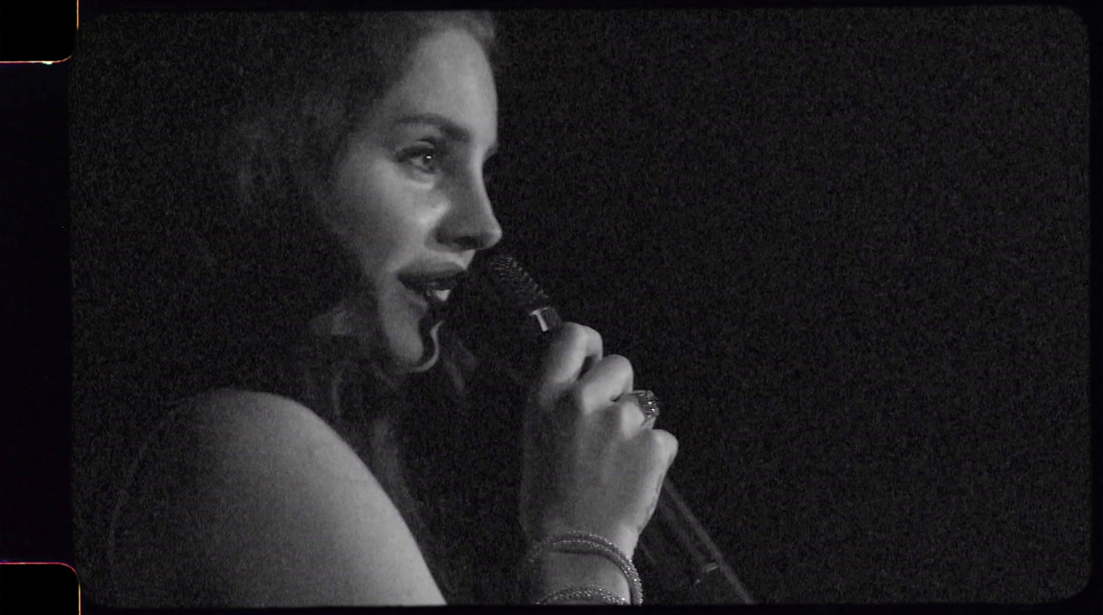 a woman holding a microphone up to her mouth