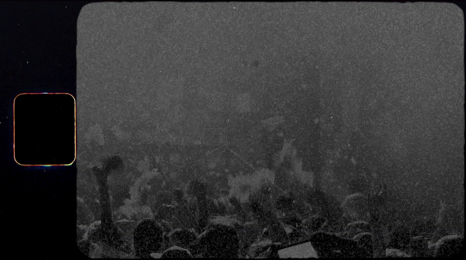 a black and white photo of a crowd of people