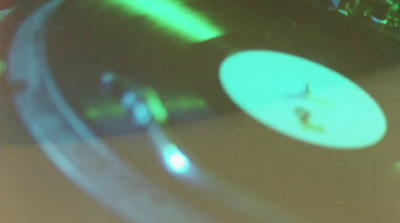 a close up of a turntable with a blurry background