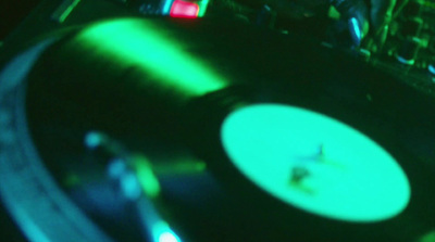 a record player playing music on a turntable