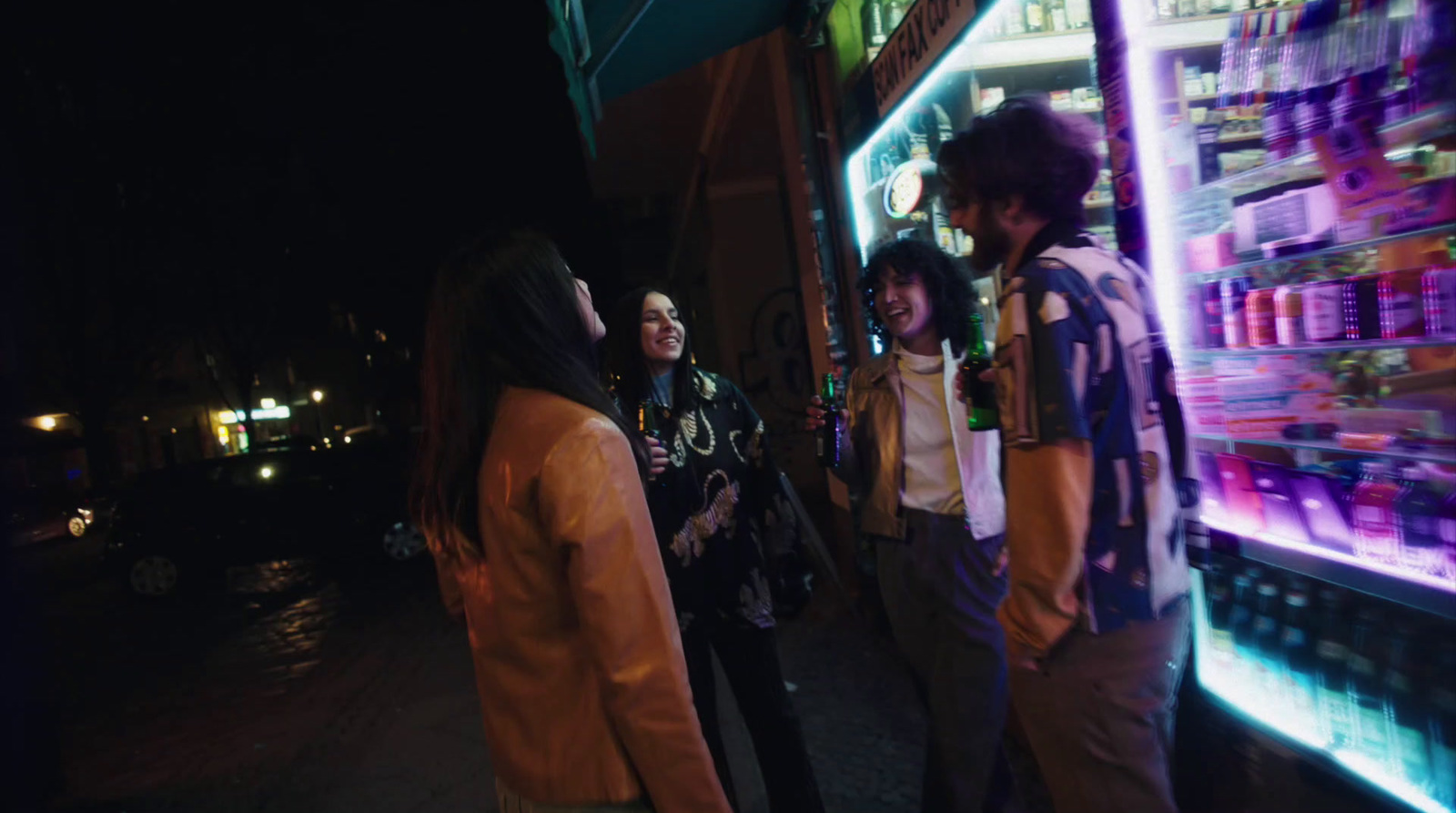 a group of people standing in front of a store