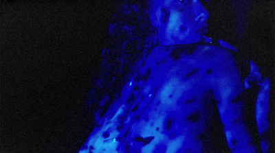 a man with blue paint on his body