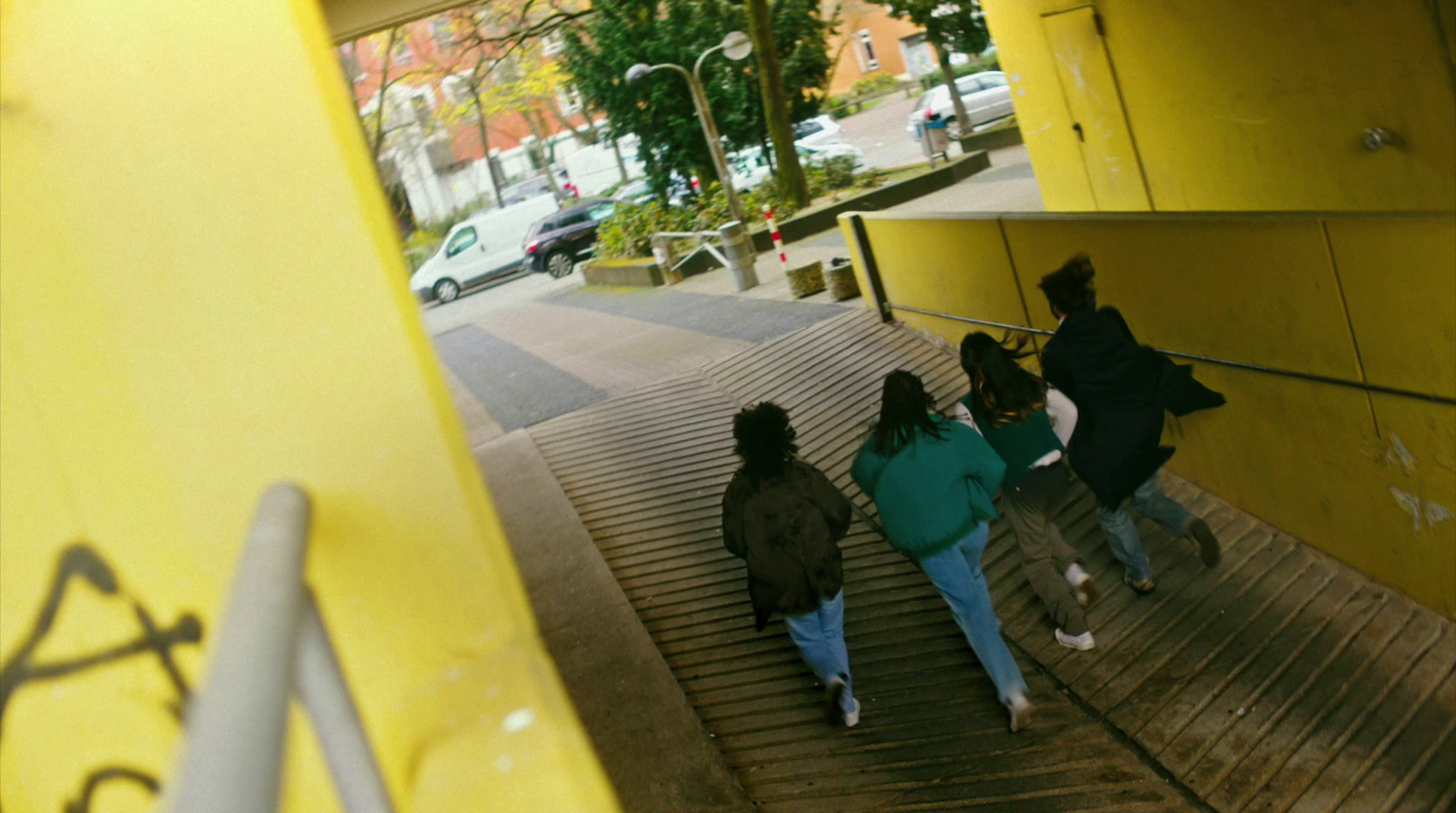 a group of people walking up a flight of stairs