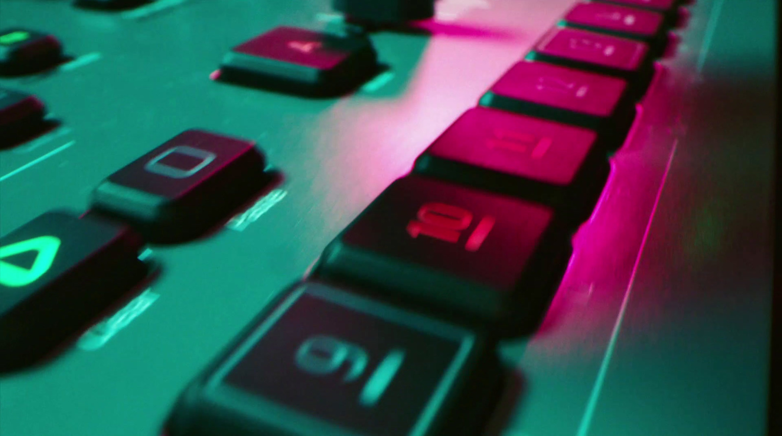 a close up of a computer keyboard with red and green keys