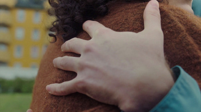 a close up of a person holding a stuffed animal