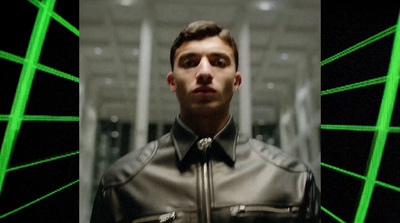 a man wearing a leather jacket and a tie